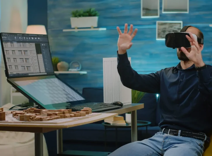Architect using vr glasses for building model design in architectural office. Man engineer working with headset and virtual reality to analyze construction layout and development.